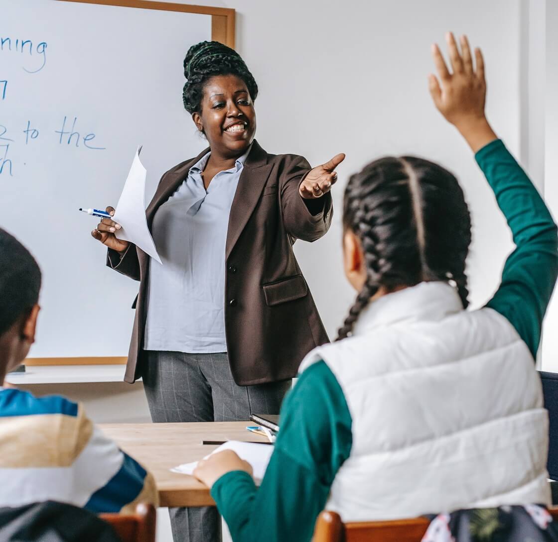 African American teacher asking students questions