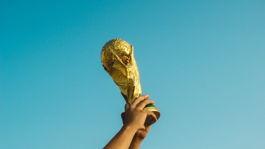 Person holding up a trophy