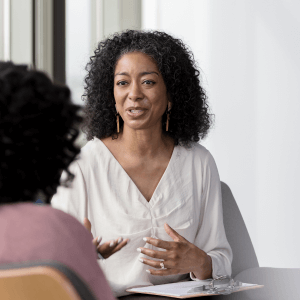 African American women talking while seated