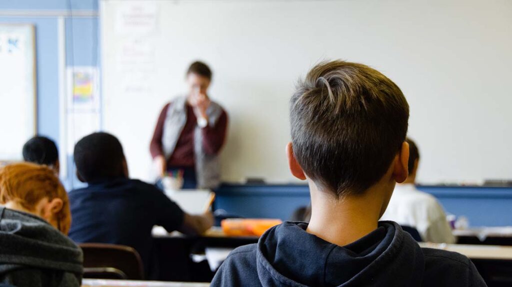 Back view of children in a classroom
