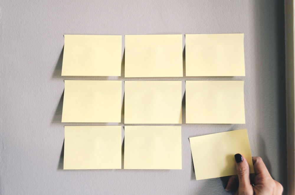 Woman putting postits on the wall