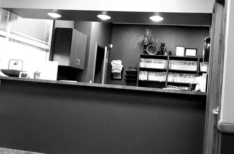 Healthcare and medicine the receptionist desk with medical files on the shelves behind