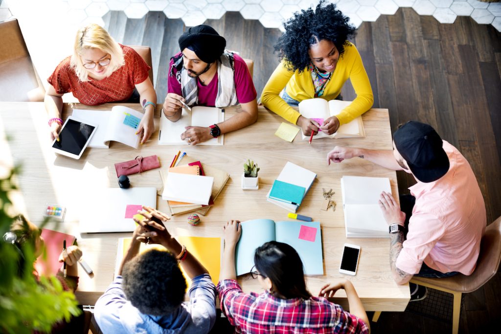 Diverse group of employees working together in a conference room