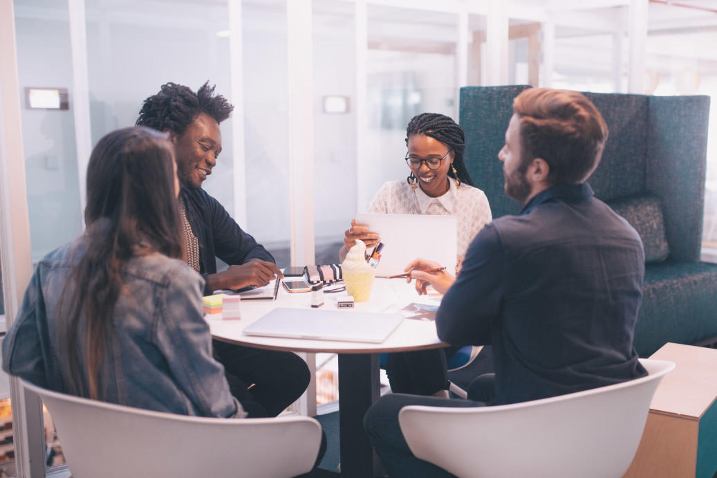 Employees having a group discussion