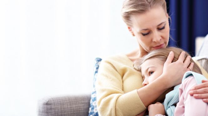 Sad mother holding autistic daughter who is lacking treatment