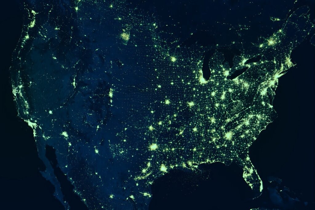Nighttime map of United States with various points of green light