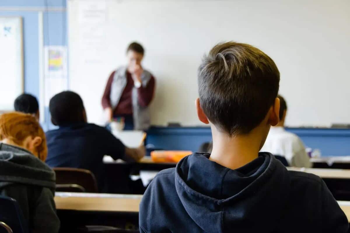 stressed teacher at front of class out of focus