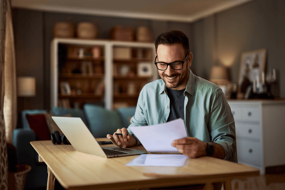 Educator reviewing documents while working at home desk