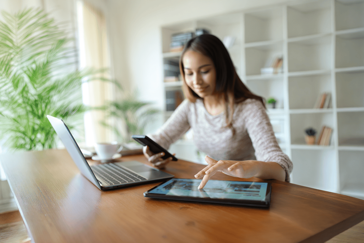 Person Managing Work on Multiple Digital Devices