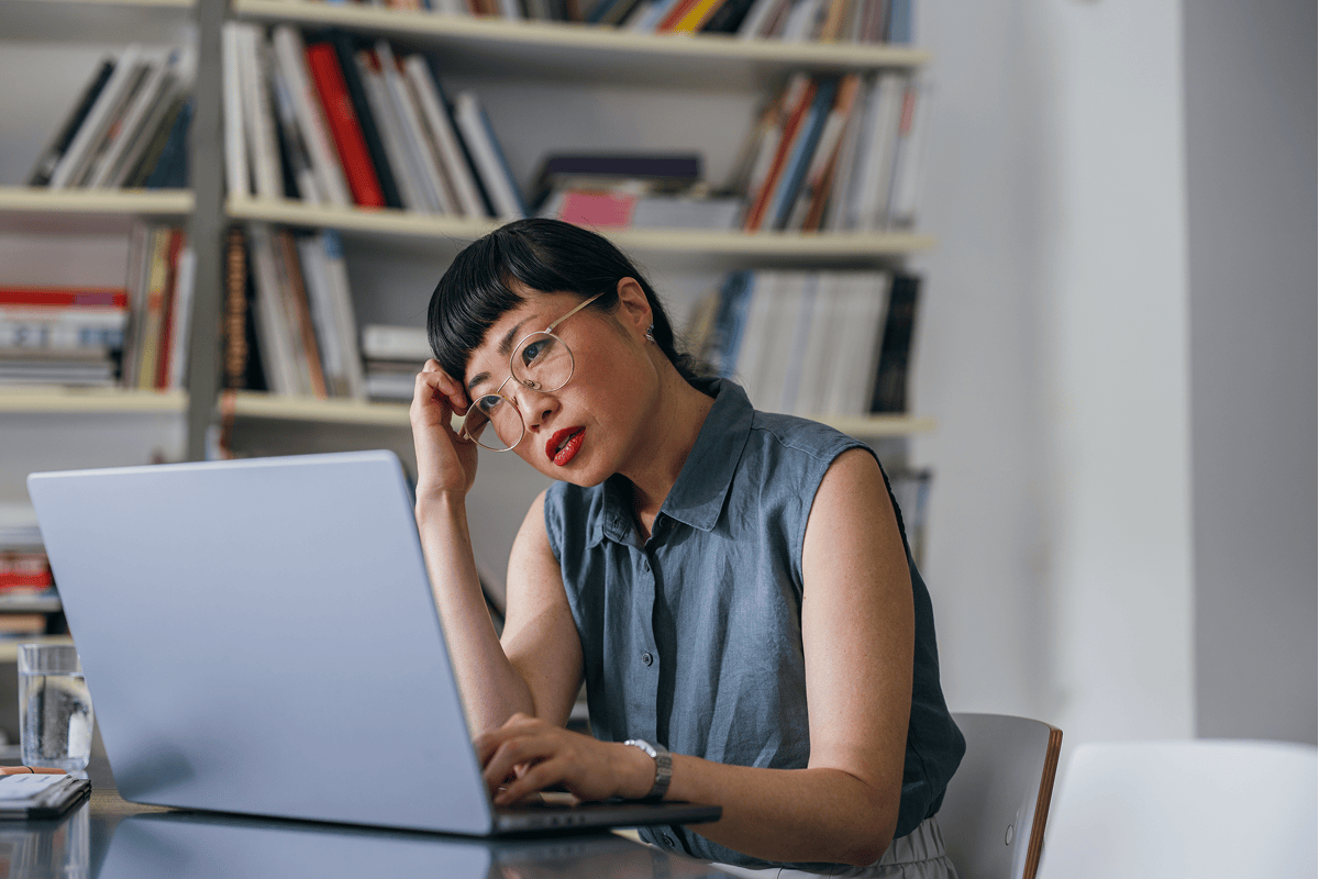 Professional-Woman-Using-Laptop-at-Home-Office-Desk